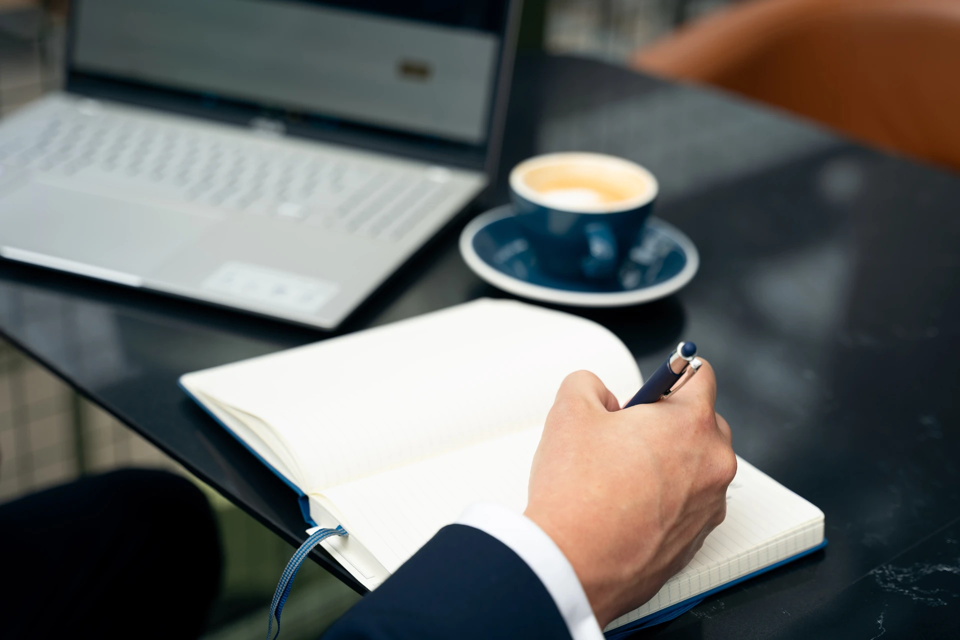 Senior hiring conversation overlooking Manchester
